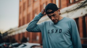 Hugh Greenwood wearing a LSKD clothing and pulling his cap backHugh Greenwood wearing a LSKD clothing and pulling his cap back