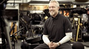 Celebrity trainer and fitness expert Gunnar Peterson smiling in the gym while giving expert fitness tips