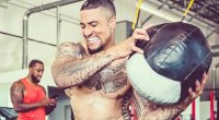Kenny Vaccaro working out in the gym with Medicine Ball Rotation