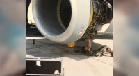 Tanji Johnson Bridgeman repairs an airplane engine