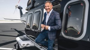 Billionare Grant Cardone stepping off his helicopter