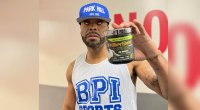 Man with contact lenses holding a bottle of BPI supplements