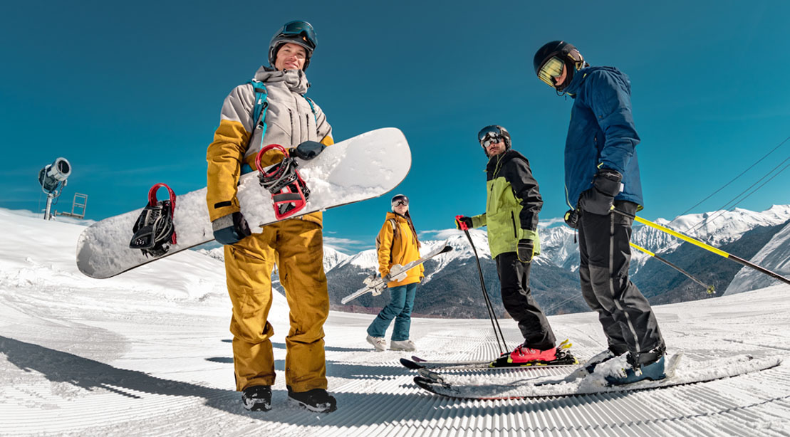 A group of winter sports athletes standing on a ski slope