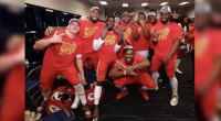 NFL KC Cheifs Defensive End George Karlaftis celebrating with his teammates in the locker room
