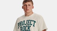 Young white teenager wearing a project rock shirt