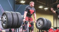 Andrew Burton deadlifting 6 tires on a barbell