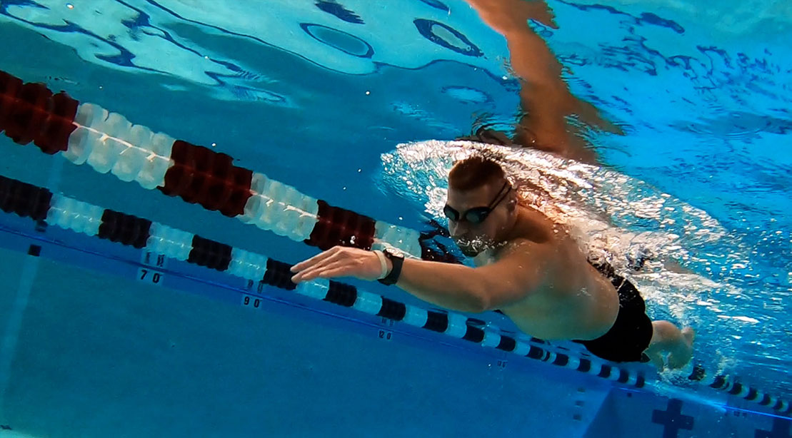 Ben Beard swimming underwater in a pool