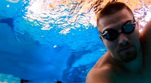 Swimmer Ben Beard taking a selfie underwater in a pool