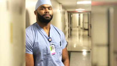 Dr. Myron Rolle in the operating scrubs