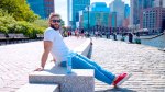 Julian Edelman sitting on a bench at the south street seaport