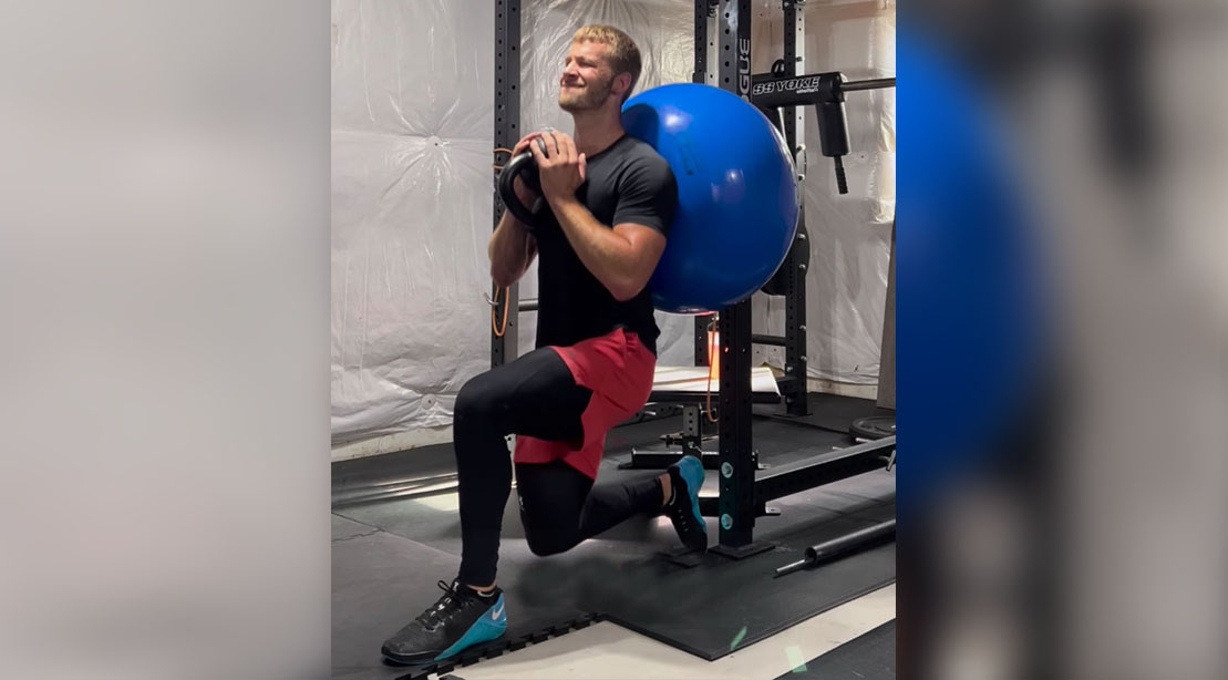  Fit man performing the Stability Ball Back Supported Split Squat