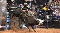 Keyshawn Whitehorse riding a bull at a rodeo