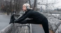 Female runner training for a cold weather running stretches