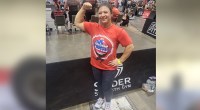 Nadia Morrison flexing her biceps after breaking the American max clean and press record