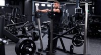 Bodybuilder Ryan Terry performing a standing chest press