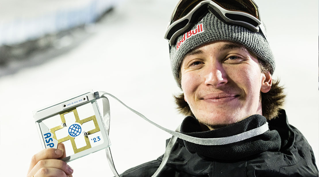 Olympic snowboarder Marcus Kleveland holding his olympic pass