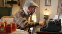 Alexander Volkanovski as an old man typing on a type writer