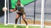 Francis Ngannou playing soccer in the goalie position