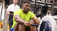 Francis Ngannou training with a row machine before a fight
